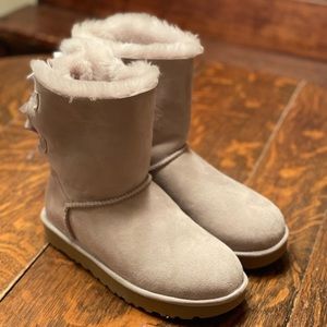 UGG Boots. Grey with Ribbon in back. Women size 9. NEVER BEEN WORN.